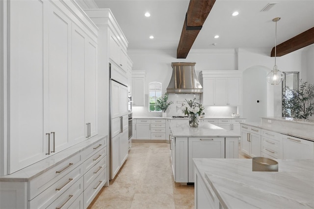 5550 Osprey Isle Ln, Orlando, FL 32819 - kitchen featuring exhaust hood, visible vents, beam ceiling, white cabinets, and recessed lighting