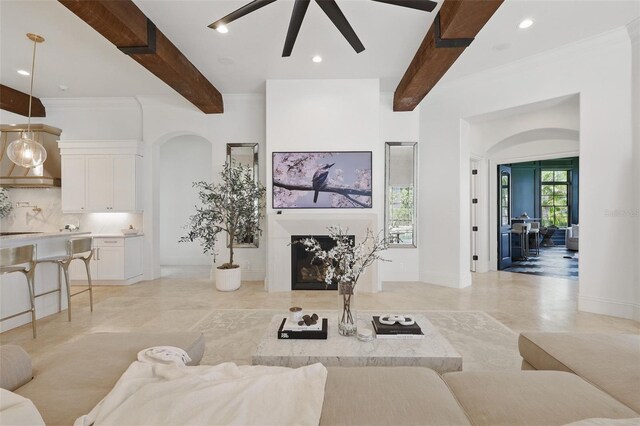 5550 Osprey Isle Ln, Orlando, FL 32819 - living area with recessed lighting, arched walkways, ceiling fan, and beamed ceiling