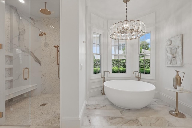 5550 Osprey Isle Ln, Orlando, FL 32819 - full bathroom featuring marble finish floor, baseboards, a freestanding bath, a chandelier, and a marble finish shower