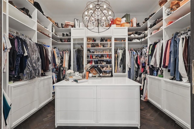 5550 Osprey Isle Ln, Orlando, FL 32819 - spacious closet with dark wood finished floors and a chandelier