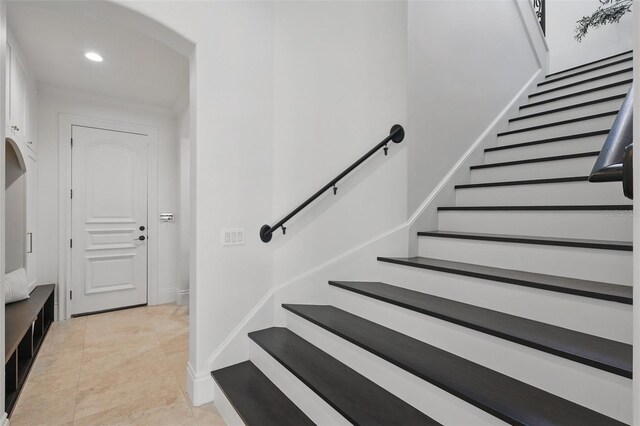 5550 Osprey Isle Ln, Orlando, FL 32819 - staircase with recessed lighting and baseboards