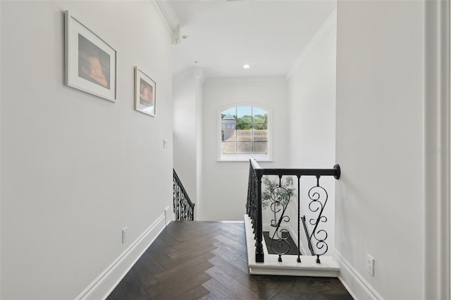 5550 Osprey Isle Ln, Orlando, FL 32819 - hallway with baseboards, ornamental molding, and an upstairs landing