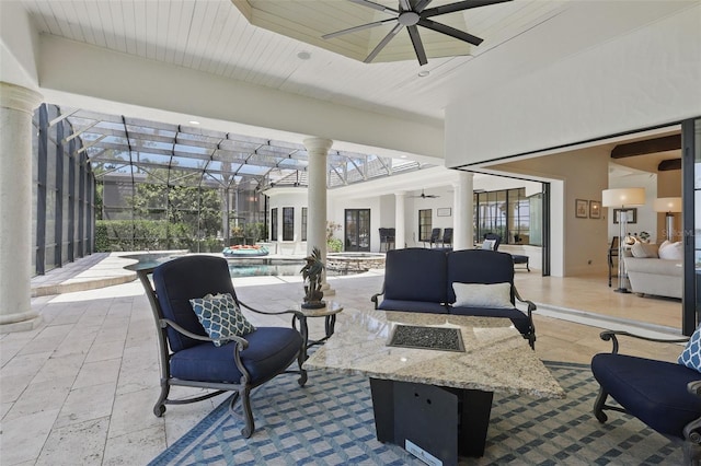 5550 Osprey Isle Ln, Orlando, FL 32819 - view of patio with glass enclosure, ceiling fan, a pool with connected hot tub, and an outdoor hangout area