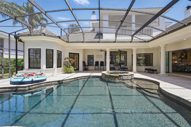5550 Osprey Isle Ln, Orlando, FL 32819 - back of house with a ceiling fan, a patio, a pool with connected hot tub, and glass enclosure