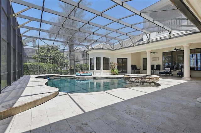 5550 Osprey Isle Ln, Orlando, FL 32819 - view of pool featuring a ceiling fan, a patio, a pool with connected hot tub, and glass enclosure