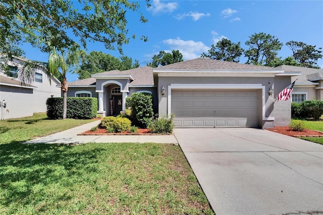 ranch-style house with a front yard, concrete driveway, stucco siding, and a garage