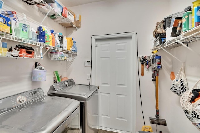 washroom with separate washer and dryer and laundry area