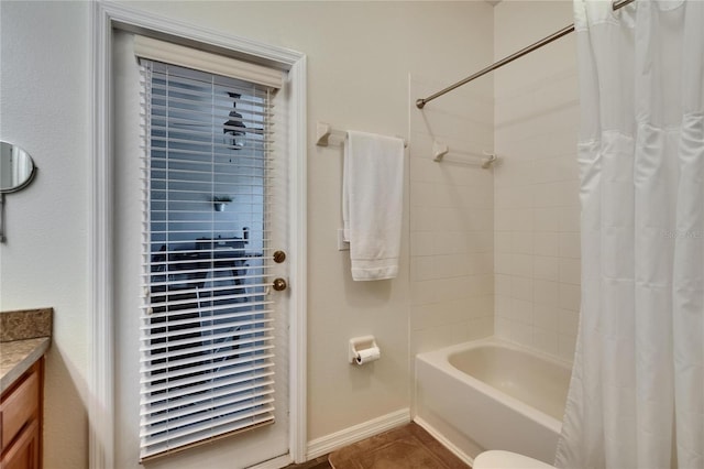 full bathroom featuring shower / bath combo with shower curtain and vanity