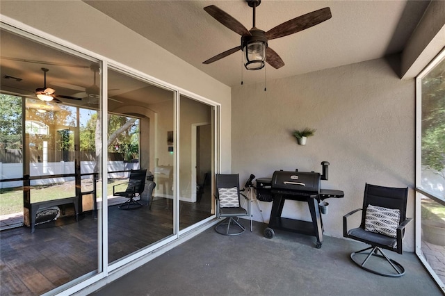 sunroom / solarium with ceiling fan