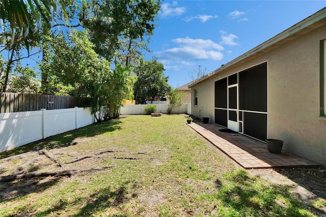 view of yard featuring a patio area and a fenced backyard