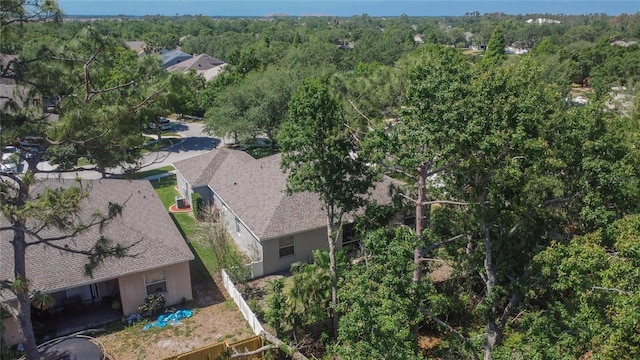 drone / aerial view featuring a forest view