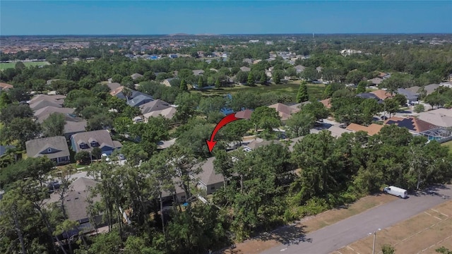 birds eye view of property with a residential view