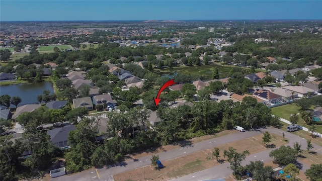 bird's eye view with a water view and a residential view