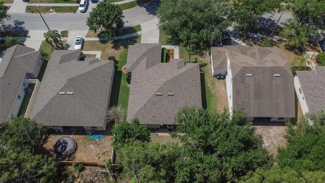 birds eye view of property with a residential view
