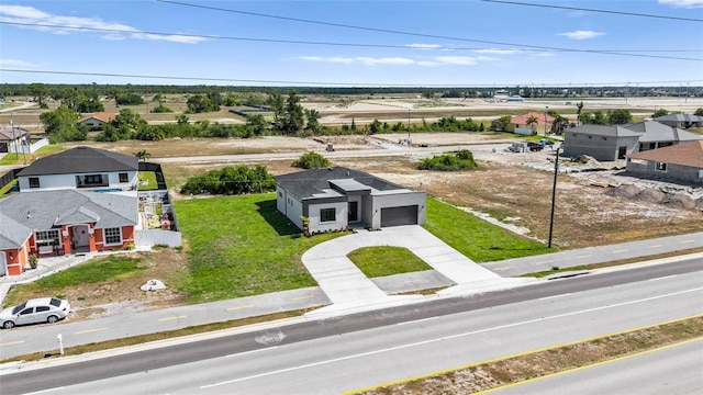 birds eye view of property with a residential view