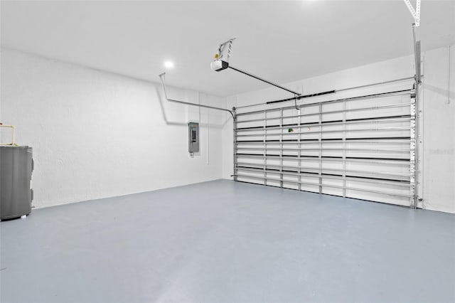 garage featuring a garage door opener, water heater, and electric panel