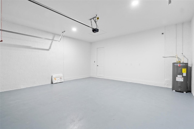 garage featuring a garage door opener and water heater