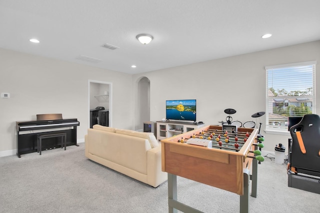 rec room featuring recessed lighting, carpet flooring, visible vents, baseboards, and arched walkways