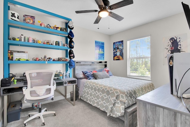 bedroom with a ceiling fan and carpet floors