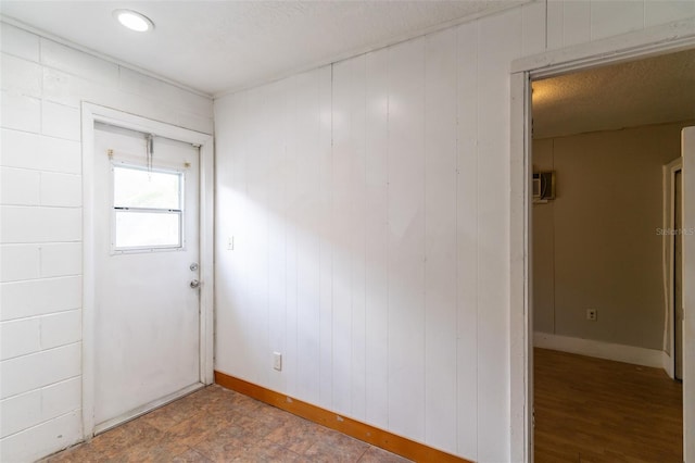 unfurnished room with baseboards