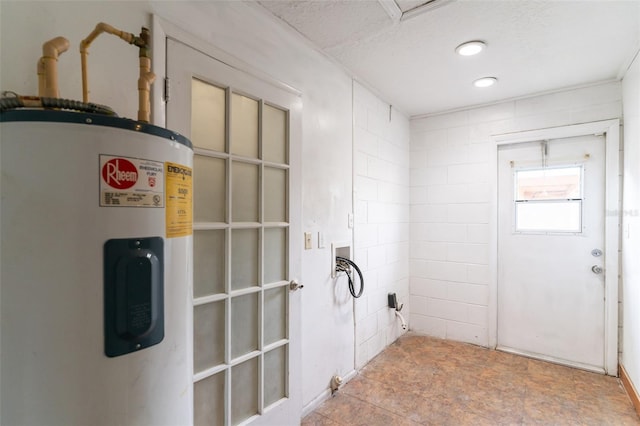 interior space featuring water heater and laundry area