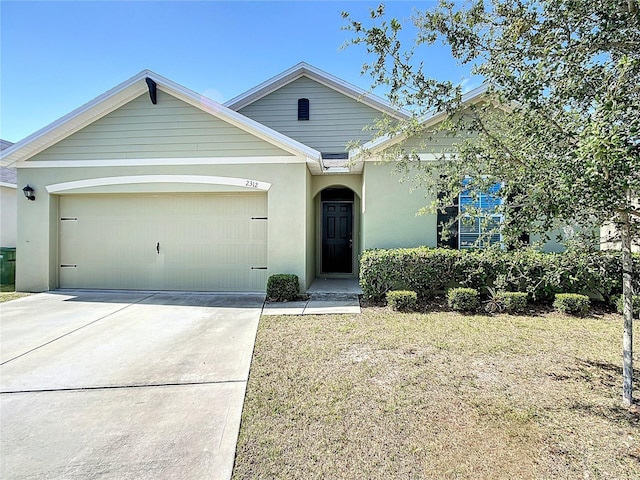 ranch-style house featuring driveway, stucco siding, and a garage