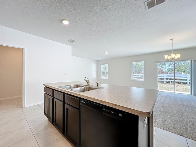kitchen featuring a sink, an inviting chandelier, dishwasher, and visible vents