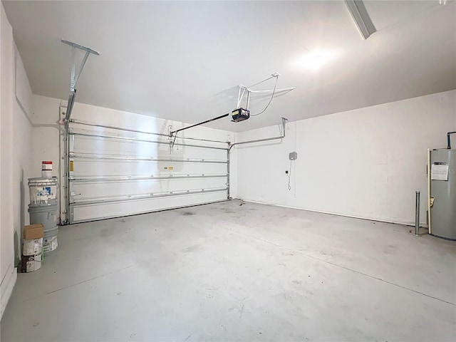 garage with a garage door opener and water heater