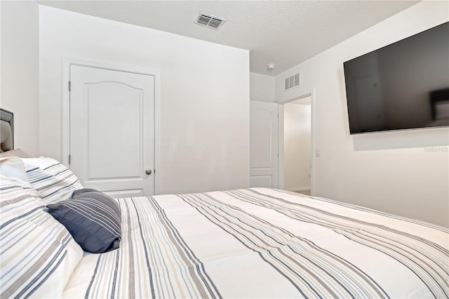 1535 Barberry Dr, Kissimmee, FL 34744 - bedroom with a textured ceiling and visible vents