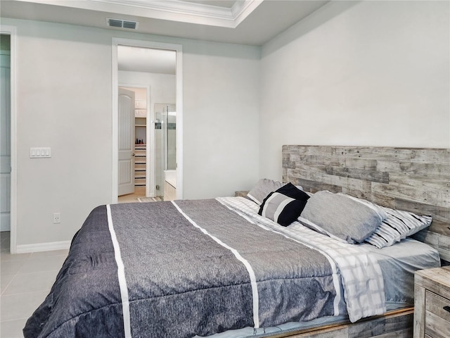 tiled bedroom with crown molding and visible vents