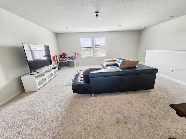 living area with a textured ceiling, baseboards, and carpet