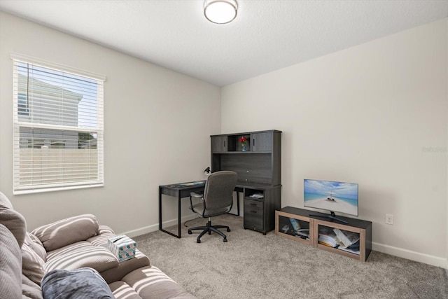 carpeted office with baseboards
