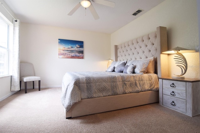 626 Verona Ave, Davenport, FL 33897 - carpeted bedroom with a ceiling fan, multiple windows, baseboards, and visible vents