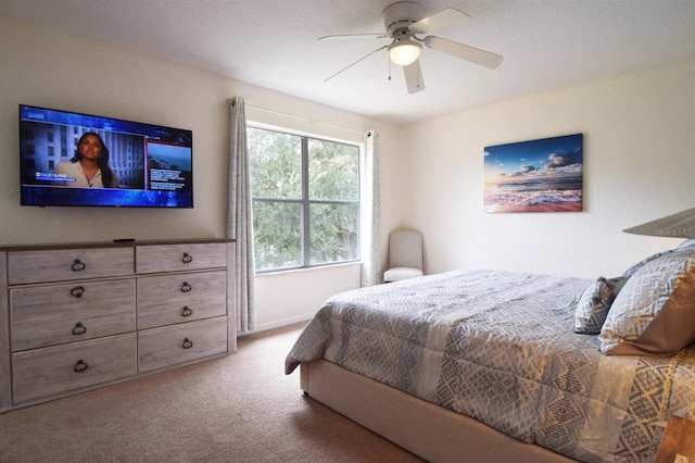 626 Verona Ave, Davenport, FL 33897 - bedroom featuring a ceiling fan, carpet flooring, and baseboards