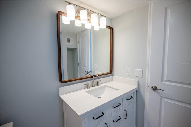 bathroom with visible vents and vanity