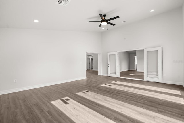 unfurnished bedroom featuring baseboards, visible vents, recessed lighting, and high vaulted ceiling