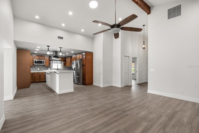 unfurnished living room featuring recessed lighting, a ceiling fan, visible vents, and light wood finished floors