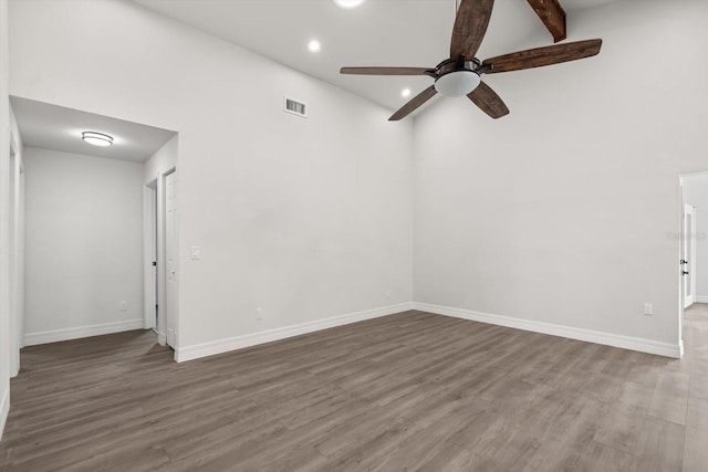 spare room with recessed lighting, wood finished floors, baseboards, visible vents, and a ceiling fan
