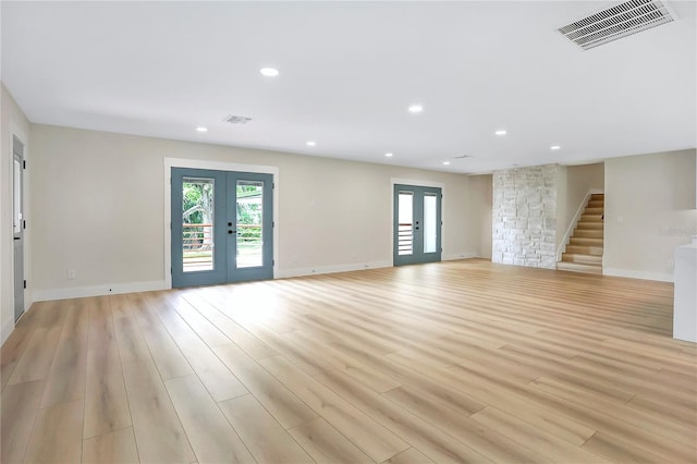 40 W Laurel St, Apopka, FL 32703 - unfurnished living room featuring visible vents, a healthy amount of sunlight, and french doors
