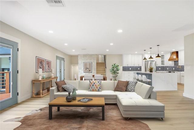 40 W Laurel St, Apopka, FL 32703 - living room with visible vents, light wood-type flooring, and recessed lighting