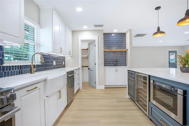 40 W Laurel St, Apopka, FL 32703 - kitchen featuring wine cooler, visible vents, appliances with stainless steel finishes, and plenty of natural light