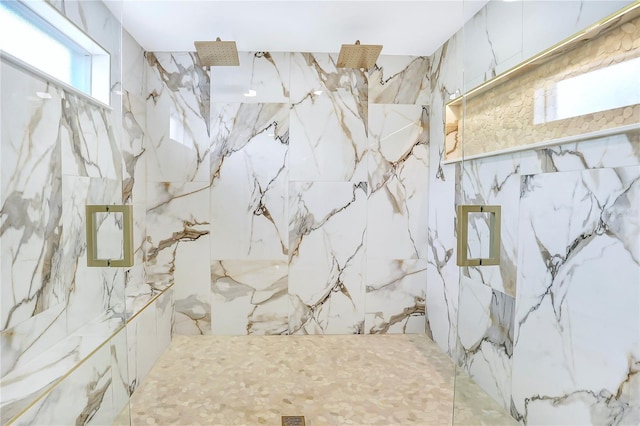 40 W Laurel St, Apopka, FL 32703 - bathroom featuring tile walls and a marble finish shower