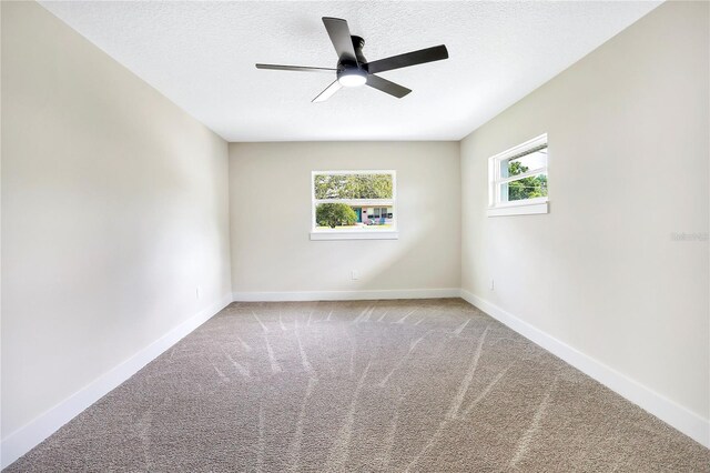 40 W Laurel St, Apopka, FL 32703 - unfurnished room with a textured ceiling, a ceiling fan, carpet flooring, and baseboards
