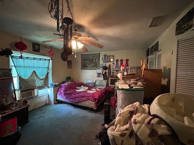 bedroom with carpet floors, a ceiling fan, and visible vents