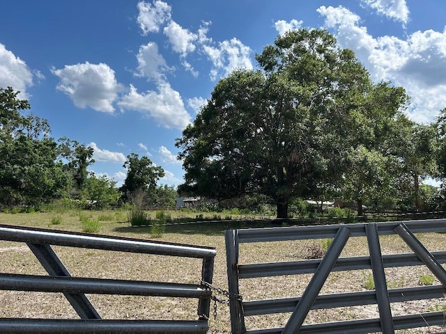 view of gate with fence