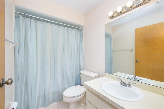 full bathroom with toilet, tile patterned floors, and vanity