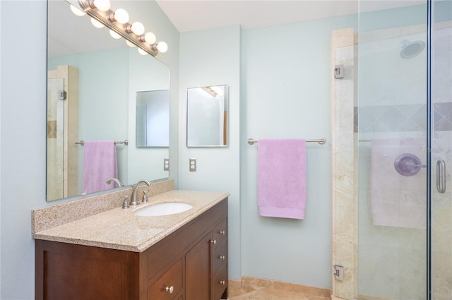 full bath with vanity and a stall shower