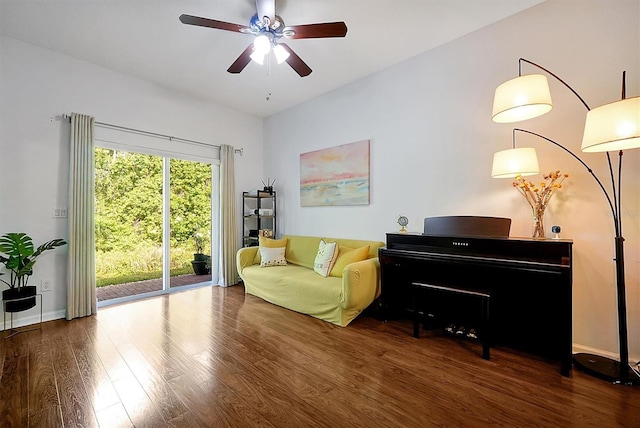 sitting room featuring baseboards, wood finished floors, and ceiling fan