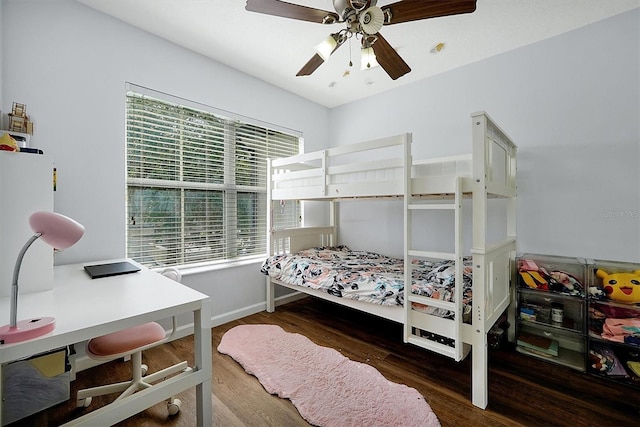 bedroom with baseboards, wood finished floors, and ceiling fan