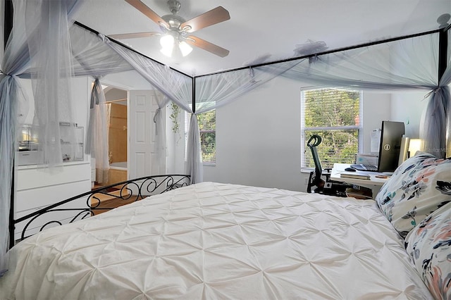bedroom with lofted ceiling and a ceiling fan